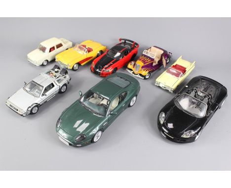 A collection of 8 diecast cars, comprising of a Hot Rod open top left hand drive (one head lamp missing) 18x7cms approx unbox