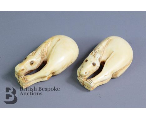 Two carved ivory netsuke, 19th century, both carved as grazing horses, approx 64 x 34 mm, finely carved with amber eyes, arti