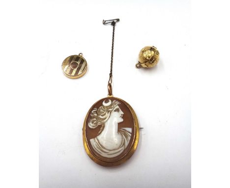 A Victorian spherical gold cased folding pendant locket, opening to reveal four compartments, the exterior with two folding s