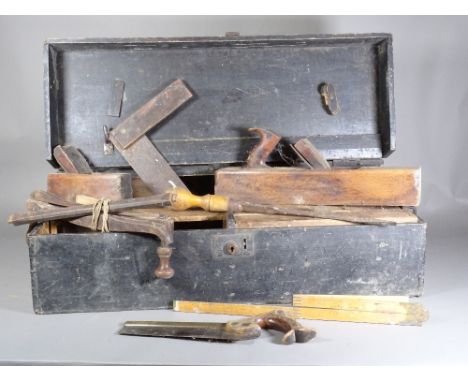 A quantity of tools in a stained pine box. 