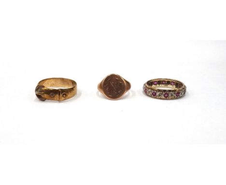 A 9ct gold ring, in a buckle and strap design, a gold oval signet ring, detailed 9 CT and a 9ct gold, diamond and ruby set fu