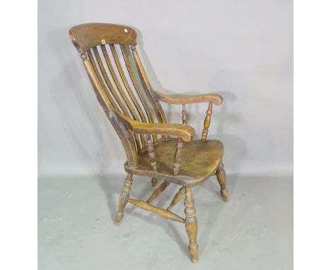 A Victorian ash and elm stick back open armchair on ring turned tapering supports. 