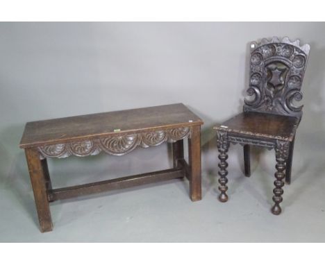 An 18th century and later oak hall bench with carved shell decoration on block supports, 95cm wide x 51cm high and a 17th cen