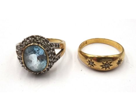 A 9ct gold, blue topaz and diamond set oval cluster ring, with diamond set split shoulders, ring size P and an 18ct gold ring