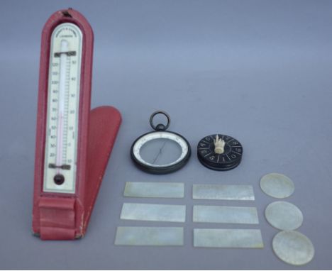 A Negretti and Zambra ivorette thermometer, cased, an unusual compass, cased and a small quantity of Chinese mother of pearl 