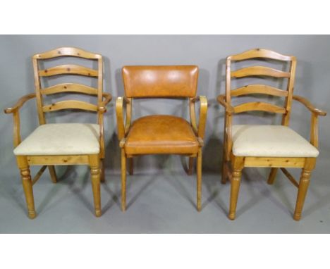 A 20th century beech bentwood open armchair with tan leather upholstery and a pair of 20th century pine ladder back open armc
