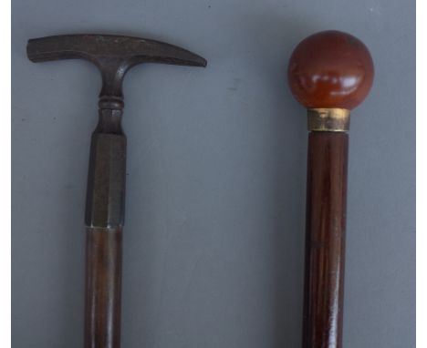 An early 20th century gadget cane with illuminating spherical pommel (91.5cm) and a mineralogist's walking stick, with steel 