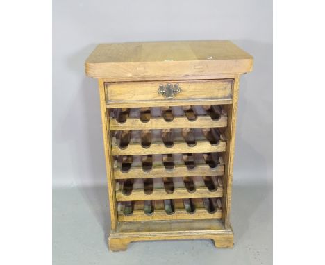 A 20th century oak five tier wine shelf with single drawer, 63cm wide x 94cm high. 