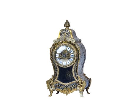 A French Boulle work mantel clock, 19th century, with foliate finial over a waisted case with enamel numerals and glazed pend