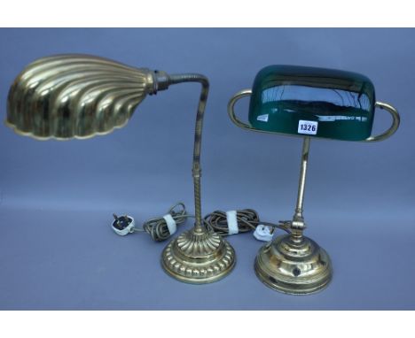 An Edwardian style gilt metal adjustable desk lamp with green glass shade and a stepped circular loaded base and one further 