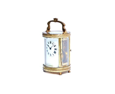 A French brass cylinder carriage timepiece, late 19th century, with visible escapement, white enamel dial and single train mo