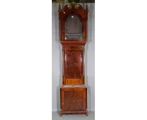 An early Victorian mahogany longcase clock case, lacking movement, the hood and trunk with wrythen turned side columns. 