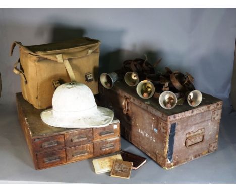 A group of six early 20th century servant bells, a pith helmet, a 19th century oak tool chest of six drawers 40cm x 16cm high