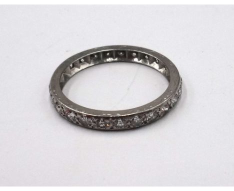 A platinum and diamond set full eternity ring, mounted with circular cut diamonds, ring size approx O and a half.