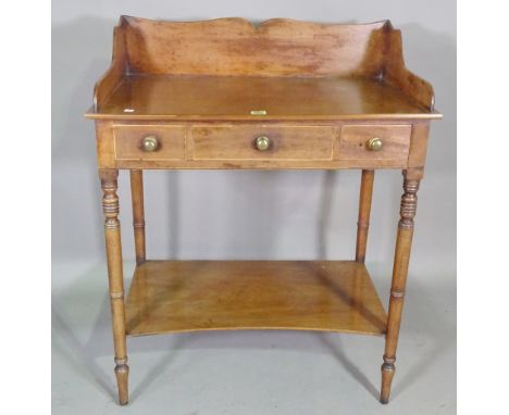 A William IV mahogany washstand with galleried top on ring turned supports, 75cm wide x 90cm high. 