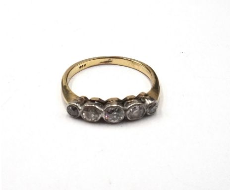 A gold and diamond five stone ring, collet set with a row of cushion shaped diamonds graduating in size to the centre stone, 