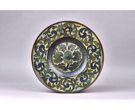 An unusual Arts and Crafts charger, first half, 20th century, foliate enamel inlaid copper in tones of blues and greens, unsi