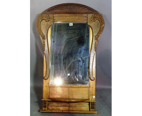 A Continental cartouche shaped wall mirror with shelf, 65cm wide x 110cm high. 