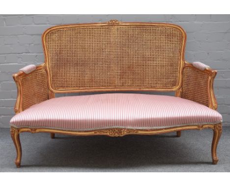 A Louis XV style salon suite comprising sofa, 135cm wide x 93cm high, pair of tub back chairs, 67cm wide x 98cm high, two ope