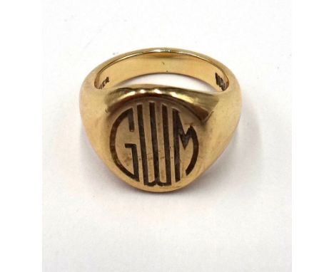 A gold oval signet ring, initial engraved and engraved Sept.6,1950 and detailed Cartier 14 K, ring size G and a half, weight 