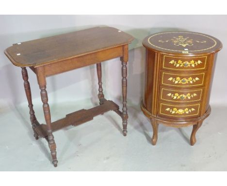 A 20th century mahogany oval chest of four short drawers on tapering supports, 49cm wide x 73cm high, a mahogany three tier c