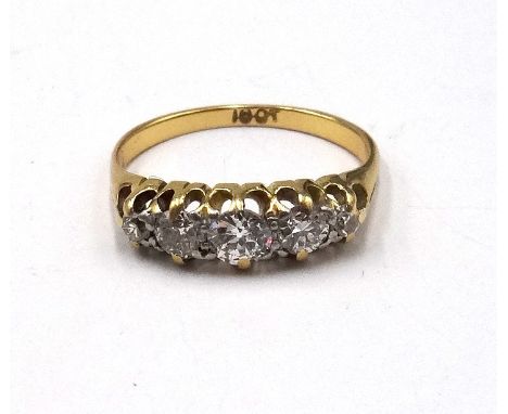 A gold and diamond set five stone ring, mounted with a row of cushion shaped diamonds graduating in size to the centre stone,