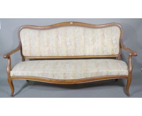 A 19th century French walnut hump back sofa with open arms on cabriole supports, 171cm wide. 