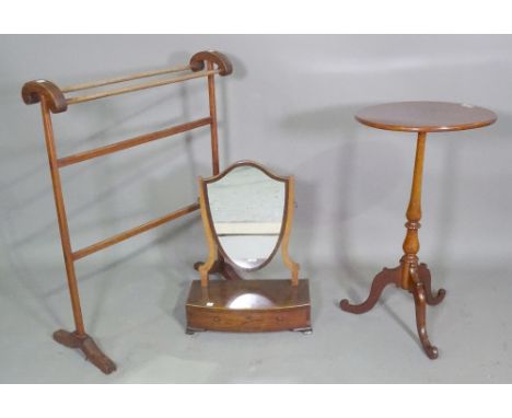A George III mahogany shield back toilet mirror on bracket feet, 39cm wide x 50cm high., a 20th century stained pine towel ra