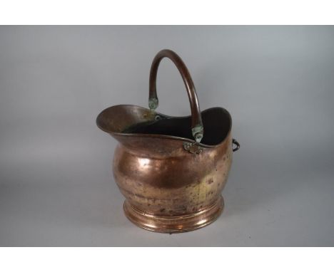 A Brass Helmet Shaped Coal Scuttle. 