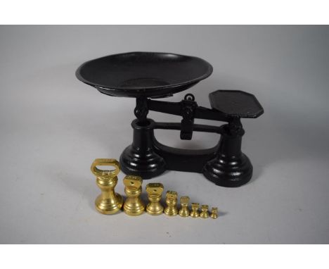 A Pair of Painted Iron Scales with Graduated Brass Bell Weights. 