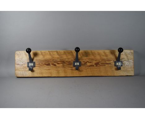 A Vintage Coat Rack with Three Cast Metal Hooks with Globular Finials &amp; Numbers 23, 24, 25. 88cm Wide. 