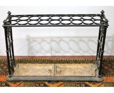 Victorian cast iron stick stand with eighteen sections, two drip trays, registration no. 336923, 90cm wide and 63cm high. Con