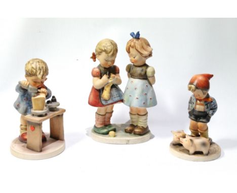 Three Goebel Hummel figurines, 'A Fair Measure', 14cm high; 'Farm Boy', 12cm high; and 'Knitting Lesson', 18cm high.
