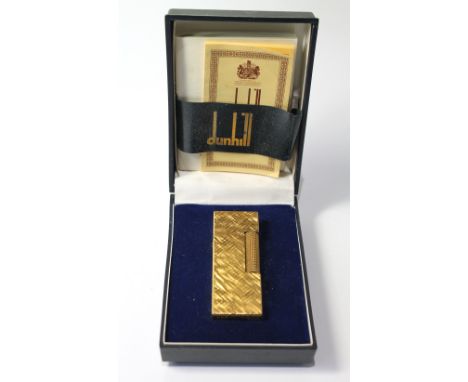 Dunhill rolled gold cigarette lighter, boxed.