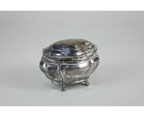 An Edward VII silver tea caddy, maker CS, London 1902, of scalloped oval form, on scroll feet, 5.5oz