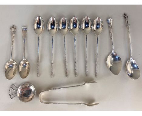 An Elizabeth II silver caddy spoon, maker Edward Victor Stanley, London, 1988, together with a silver caddy spoon with figura