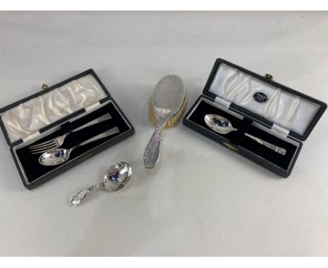 A George III silver caddy spoon with Shell cast handle, possibly 1816, a George V cased silver fork and spoon set, Sheffield 