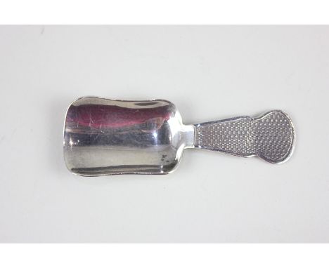 A George V silver caddy spoon with engine turned engraved handle, Birmingham 1920