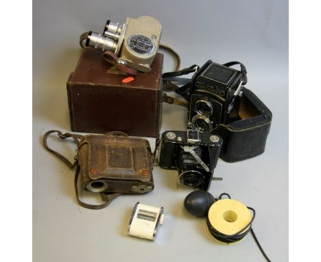 A MINOLTA AUTOCORD TLR CAMERA, with a black leather case, a Zeiss Ikon Ikonta A and a Bell and Howell 605 Run Eight Cine came