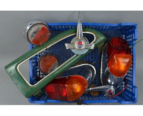 A QUANTITY OF MORRIS MINOR SPARE PARTS, a pair of rear light clusters, not tested (post 1962), a pair of front indicator lens