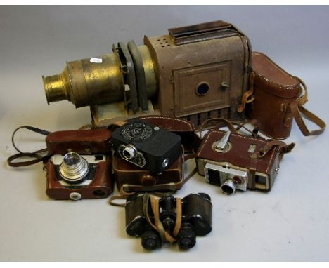 TWO TRAYS OF CAMERAS, BINOCULARS AND MAGIC LANTERN, these include a pair of Wray Raylite 8x30 binoculars in leather case, a W