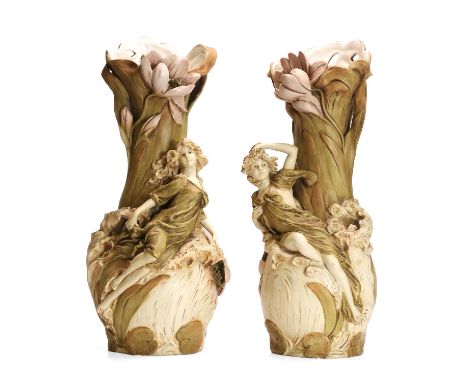 A pair of Art Nouveau figural vases, early 20th century, manufactured by Royal Dux, each decorated in a matt ivory glaze depi
