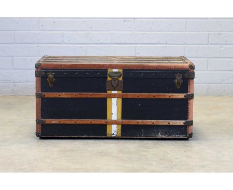 A Goyard 'Malle Courrier' steamer trunk, early 20th century, of typical form, the sides upholstered with black canvas, painte