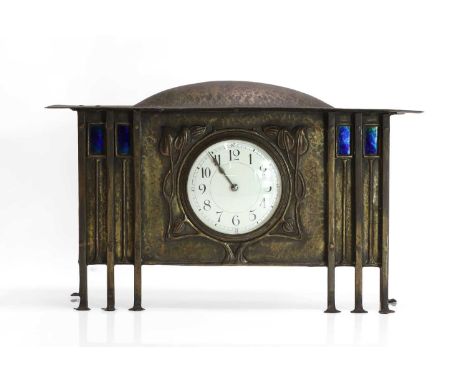 A Glasgow School planished brass mantel clock,  c.1900, attributed to George Walton (1867-1933), the round dial set in a repo