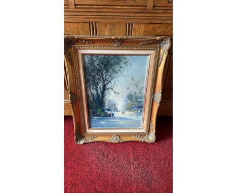 Impressionist oil painting of a street scene, signed by the artist. Ornate gold frame with intricate detailing.