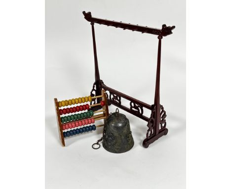 A Chinese style modern bronzed metal bell with dragon style chased cast design (10cm x 9.5cm) , a table child's abacus (15cm 