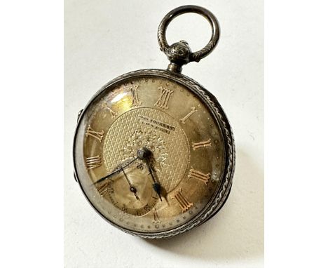 An Edwardian Chester silver open faced pocket watch retailed by John Forrest, London with silver engine turned dial and subsi