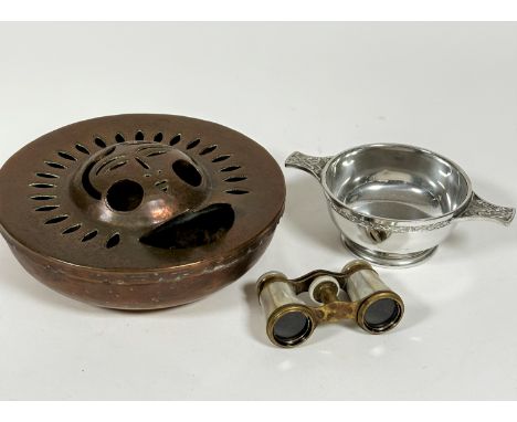 A pair of mother of pearl brass mounted opera glasses complete with all panels etc (5.5cm) a pewter quaich in Celtic style, (