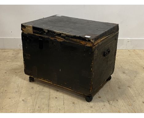 An early 20th century canvas covered and metal bound trunk, moving on later castors, h52cm, w66cm, d50cm