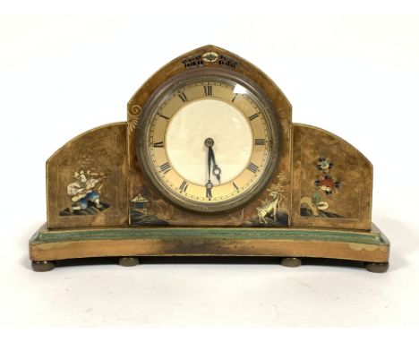 A 1930s walnut chinoiserie decorated arched mantel clock of curved form with enamelled and gilt metal dial with Roman numeral
